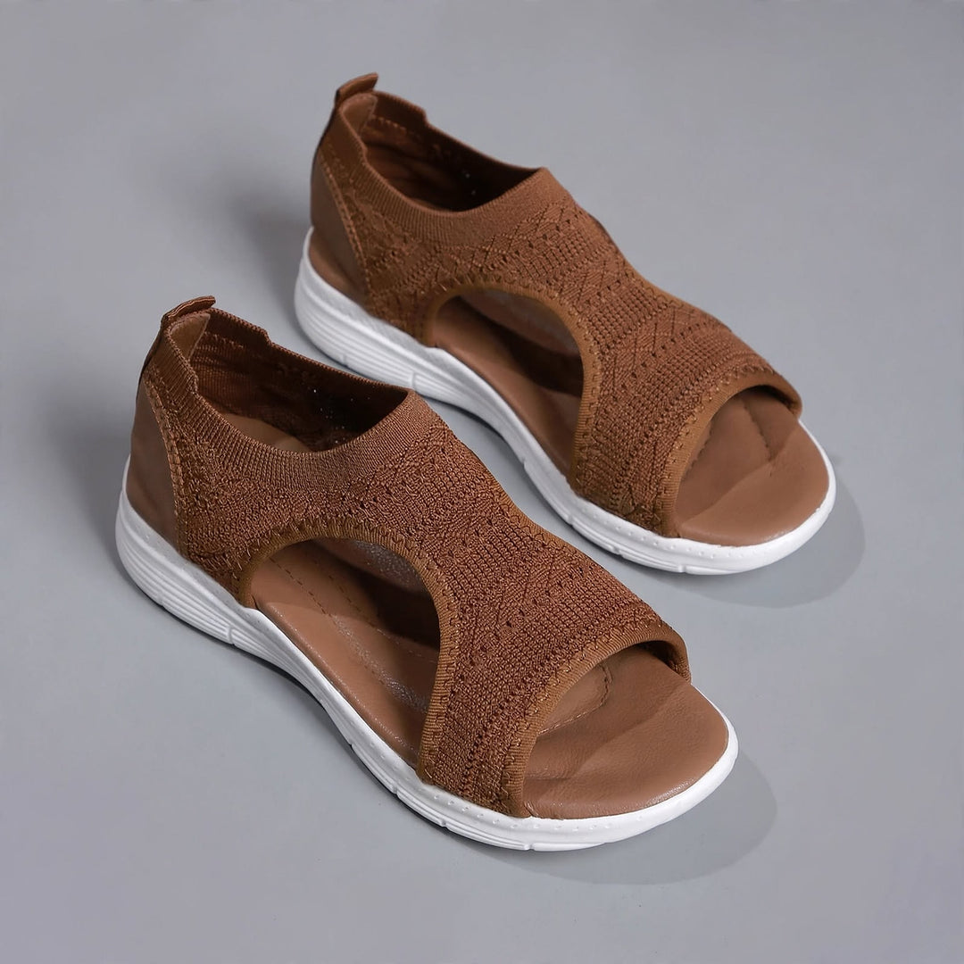 Warm brown open toe knitted sandals with white sole and tone-on-tone stitching.