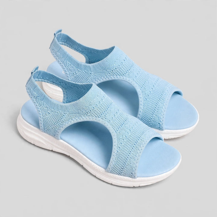 Sky blue open toe knitted sandals with a white sole and tone-on-tone stitching.