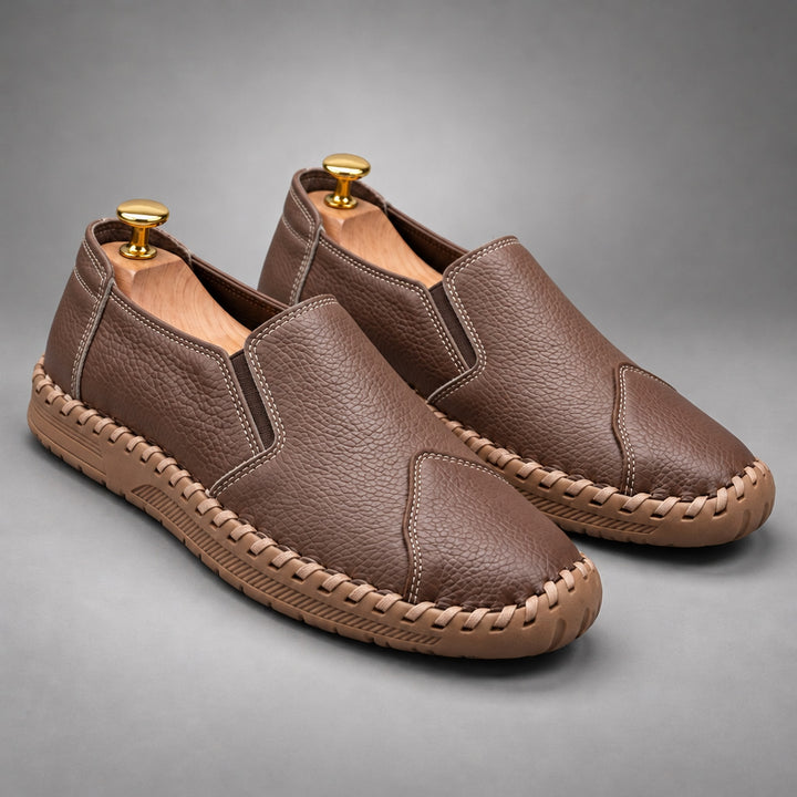 Loafers with a medium brown pebbled body and a light brown sole.