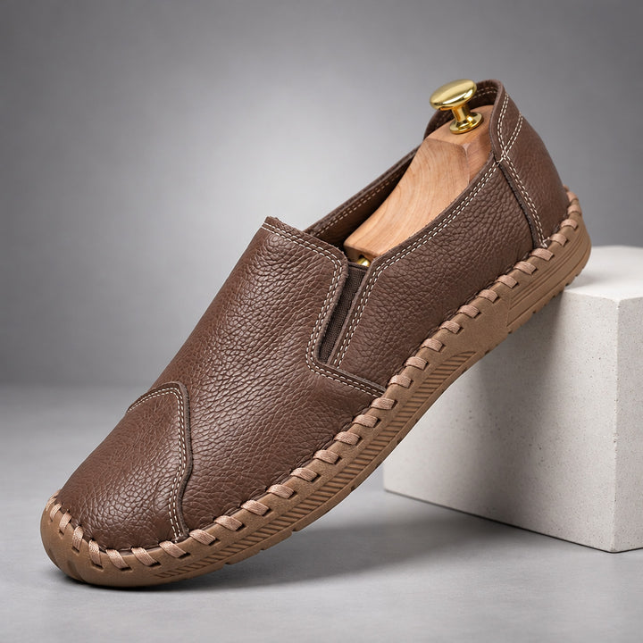 Loafers with a medium brown pebbled body and a light brown sole. (plinth)