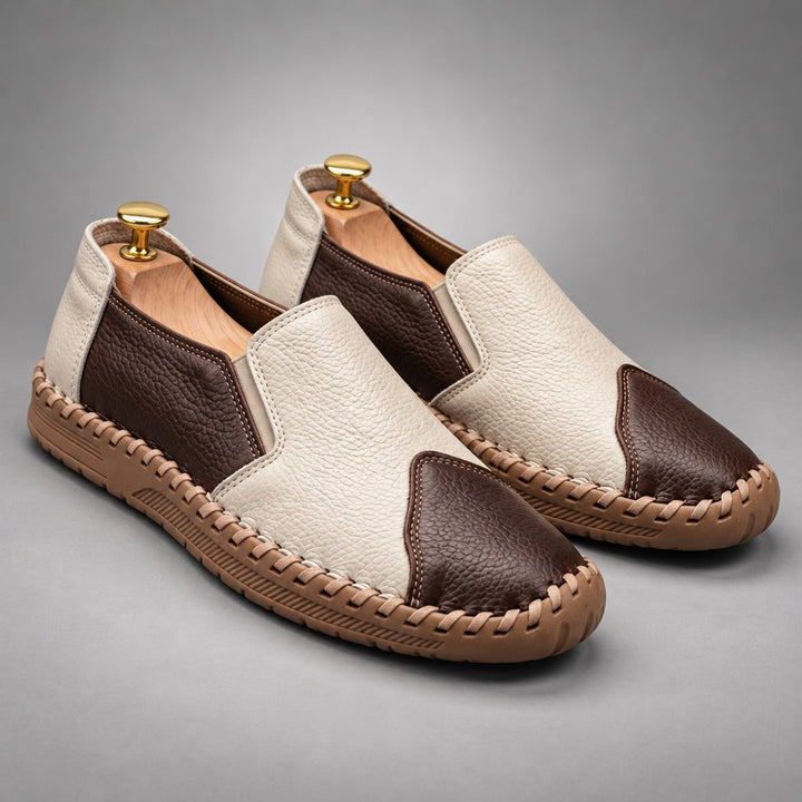 Loafers with a cream and dark brown pebbled body and a light brown sole.
