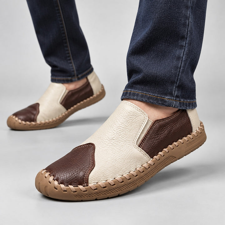 Loafers with a cream and dark brown pebbled body and a light brown sole. (on model)
