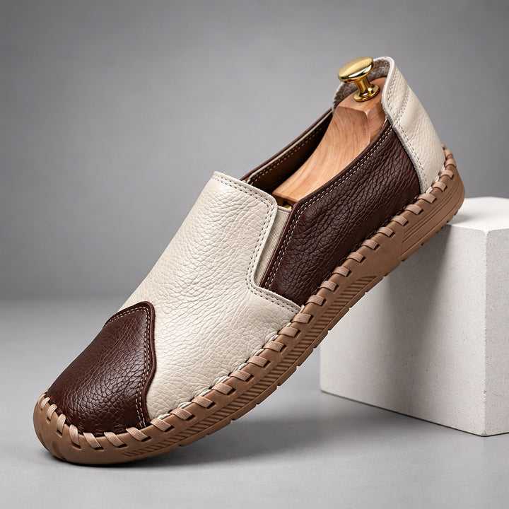 Loafers with a cream and dark brown pebbled body and a light brown sole. (plinth)