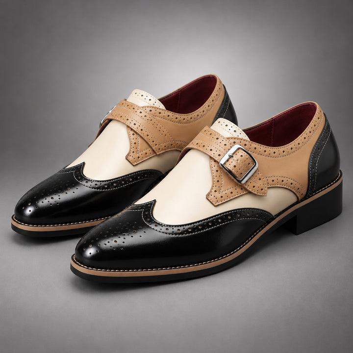 Loafers in black, tan and cream with tan detail stitching and a silver buckle.