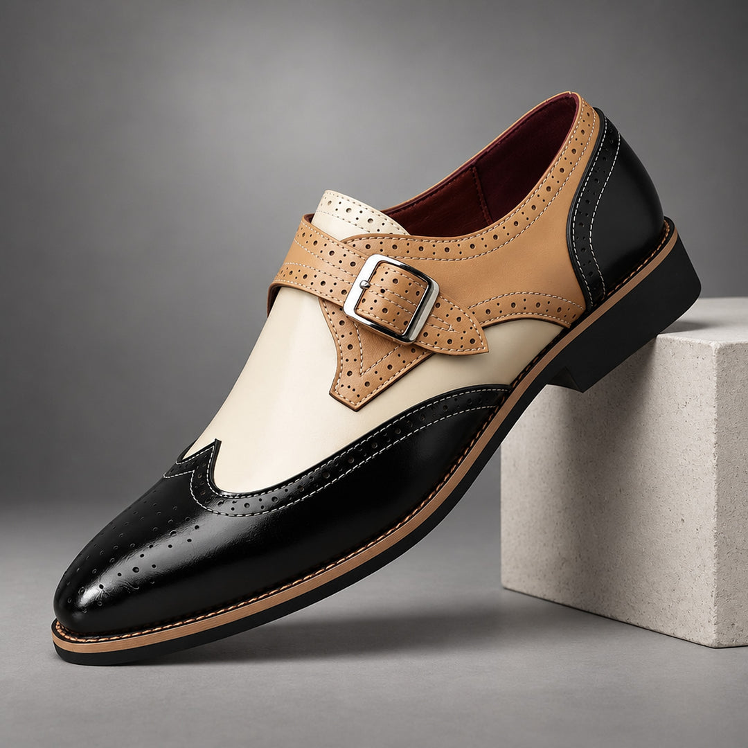 Loafers in black, tan and cream with tan detail stitching and a silver buckle. (plinth)
