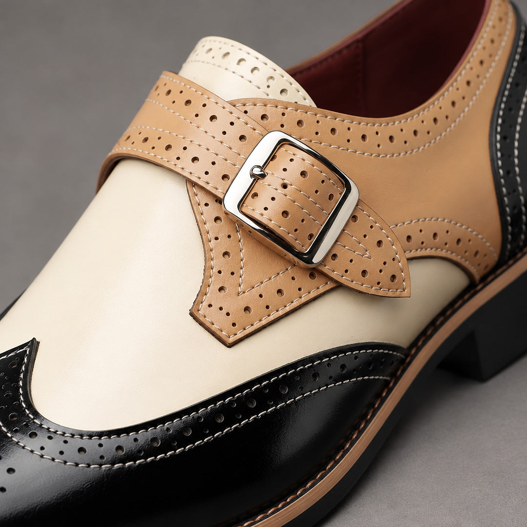 Loafers in black, tan and cream with tan detail stitching and a silver buckle. (alt macro)