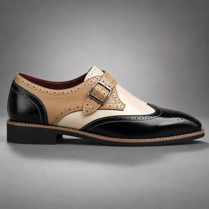 Loafers in black, tan and cream with tan detail stitching and a silver buckle. (side profile)