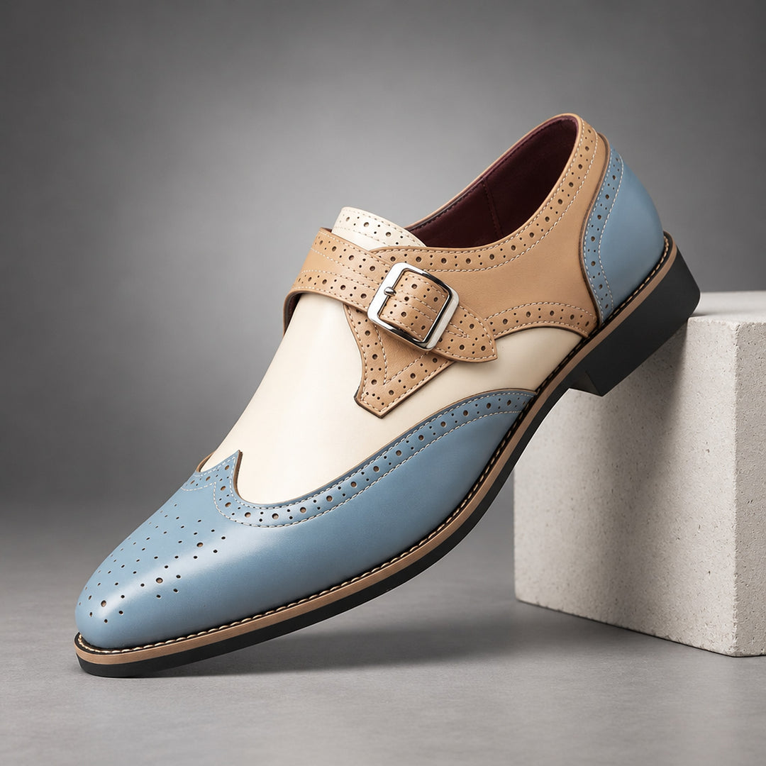 Loafers in light blue and beige with cream detail stitching and a silver buckle. (plinth)