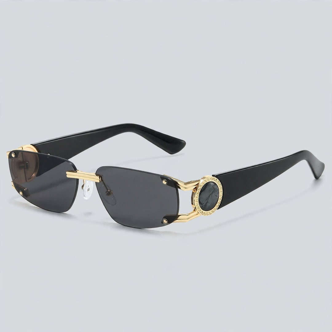 These sunglasses have glossy black temples, shiny gold metal connectors, and dark gray lenses.