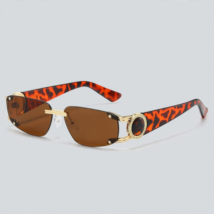 These sunglasses show orange and dark brown patterned temples, gold metal, and brown lenses.