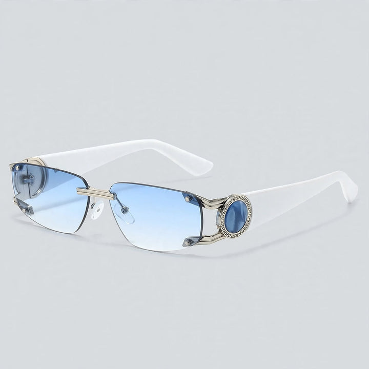 These sunglasses show matte white temples, polished silver metal, and light blue gradient lenses.