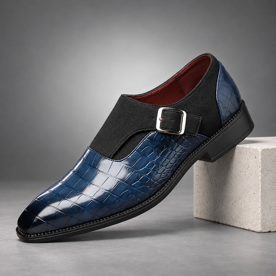 Glossy crocodile pattern navy loafers with a silver buckle and black sole.