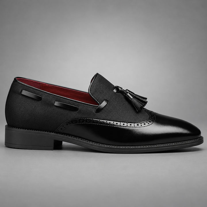 Black shoes with a mix of glossy leather and matte textured fabric, finished with black stitching. (side profile)
