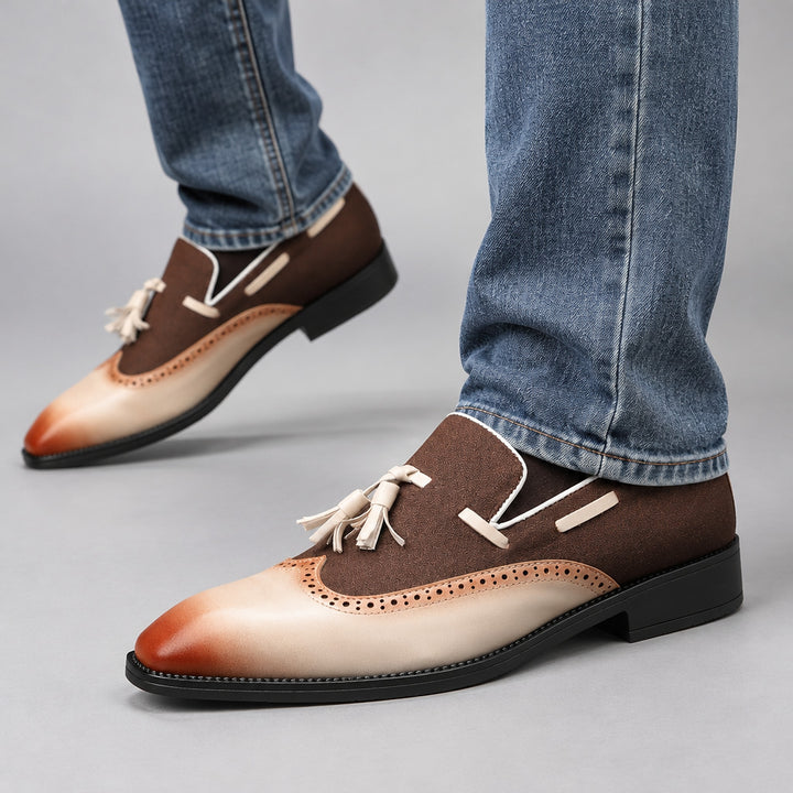 Dark brown and cream shoes with tan accents and a matte finish, detailed with matching stitching. (on model)
