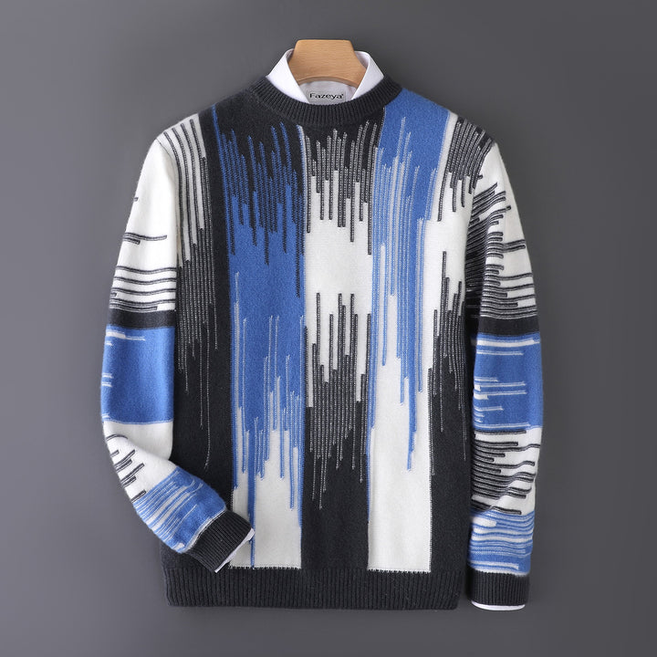 Black, blue, and white sweater with bold vertical abstract stripes and black ribbed trims.
