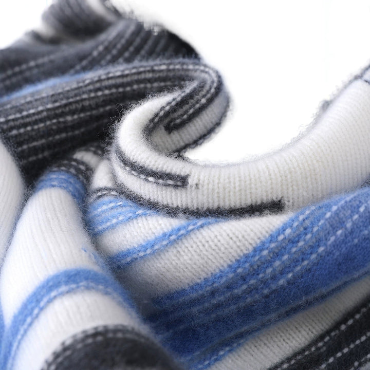 Black, blue, and white sweater with bold vertical abstract stripes and black ribbed trims. (photo 3)