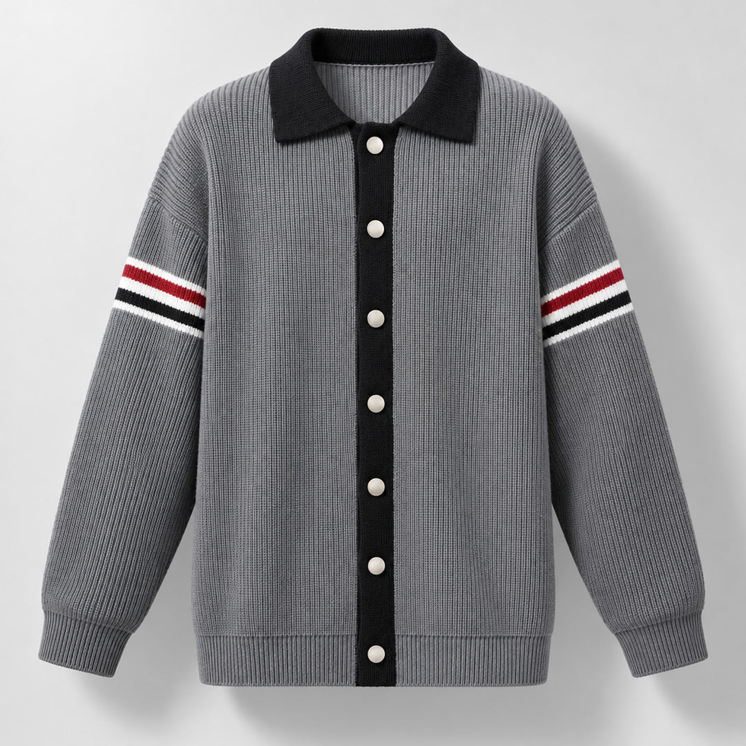 Cardigan sweater in medium gray with matte silver buttons and black trim.