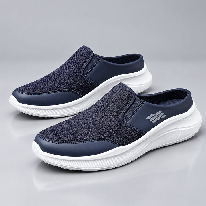 Navy blue backless slip-on shoes with a white sole and matte finish