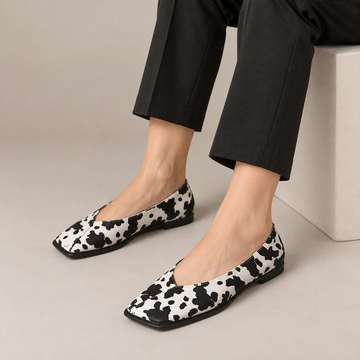 Mirana Leather Flats in Cow color (on model legs)