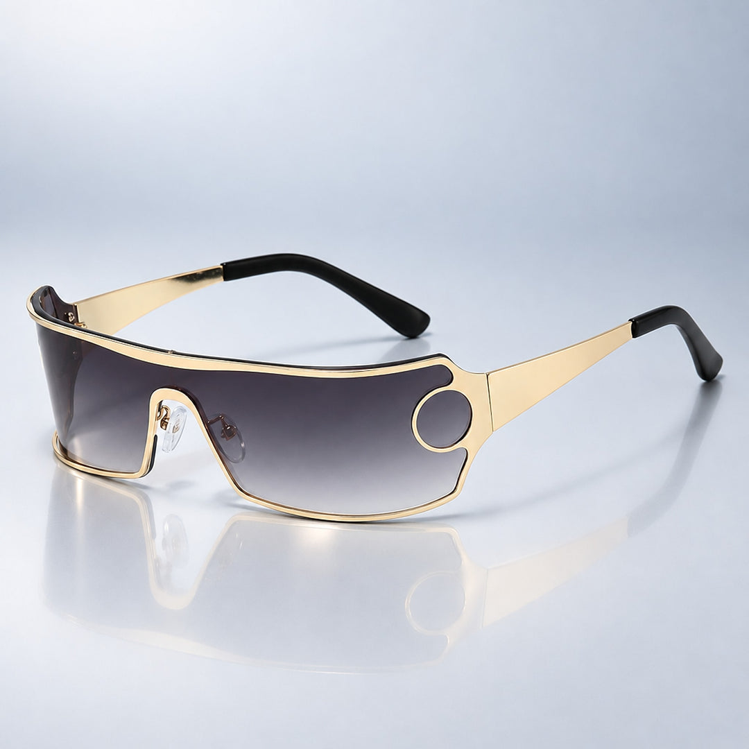 Wraparound sunglasses with a metallic gold frame, black tips, and dark gray gradient lens.