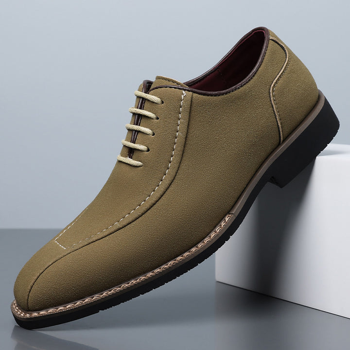 Matte olive green oxfords with light beige stitching and a black sole edged in brown.