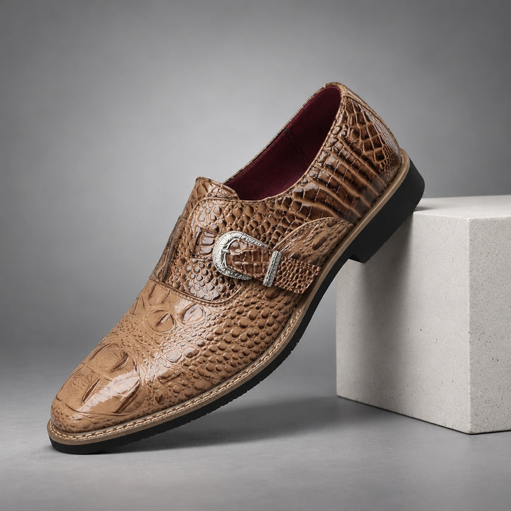 Glossy brown loafers with caramel shading, black sole, beige stitched edge and crocodile pattern upper.