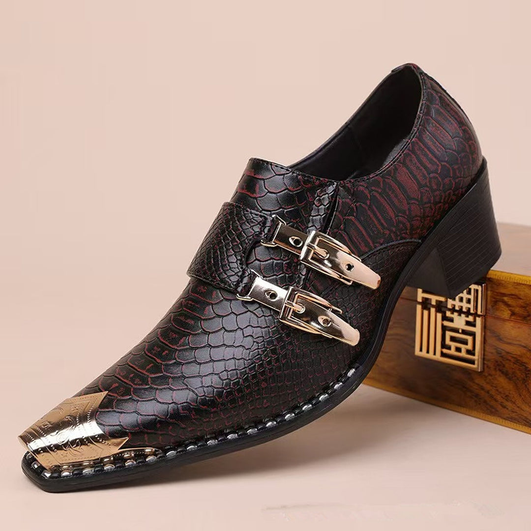 Dark brown loafers with red undertones, glossy reptile texture, gold hardware and black sole.