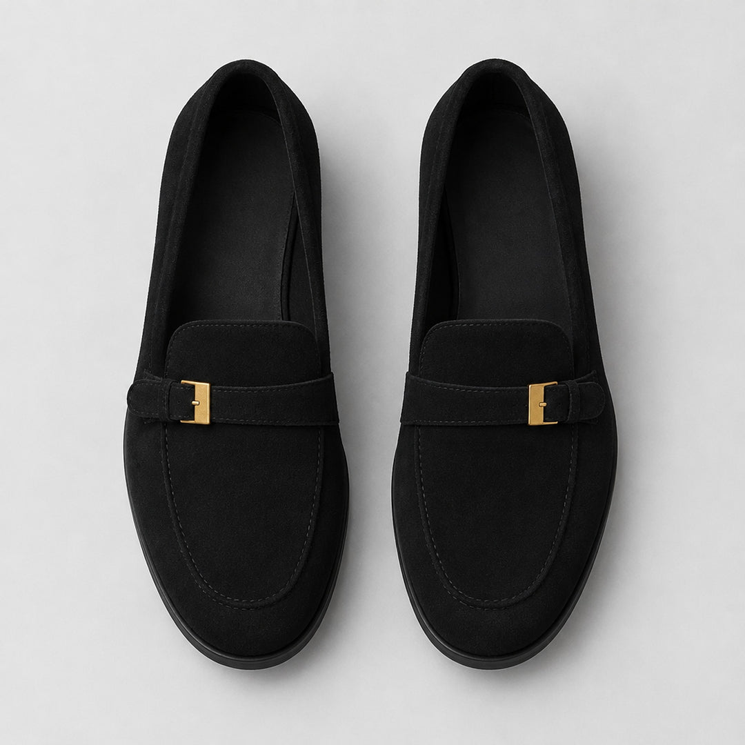 Matte black suede-look loafers with a black sole and gold buckle. (top down)