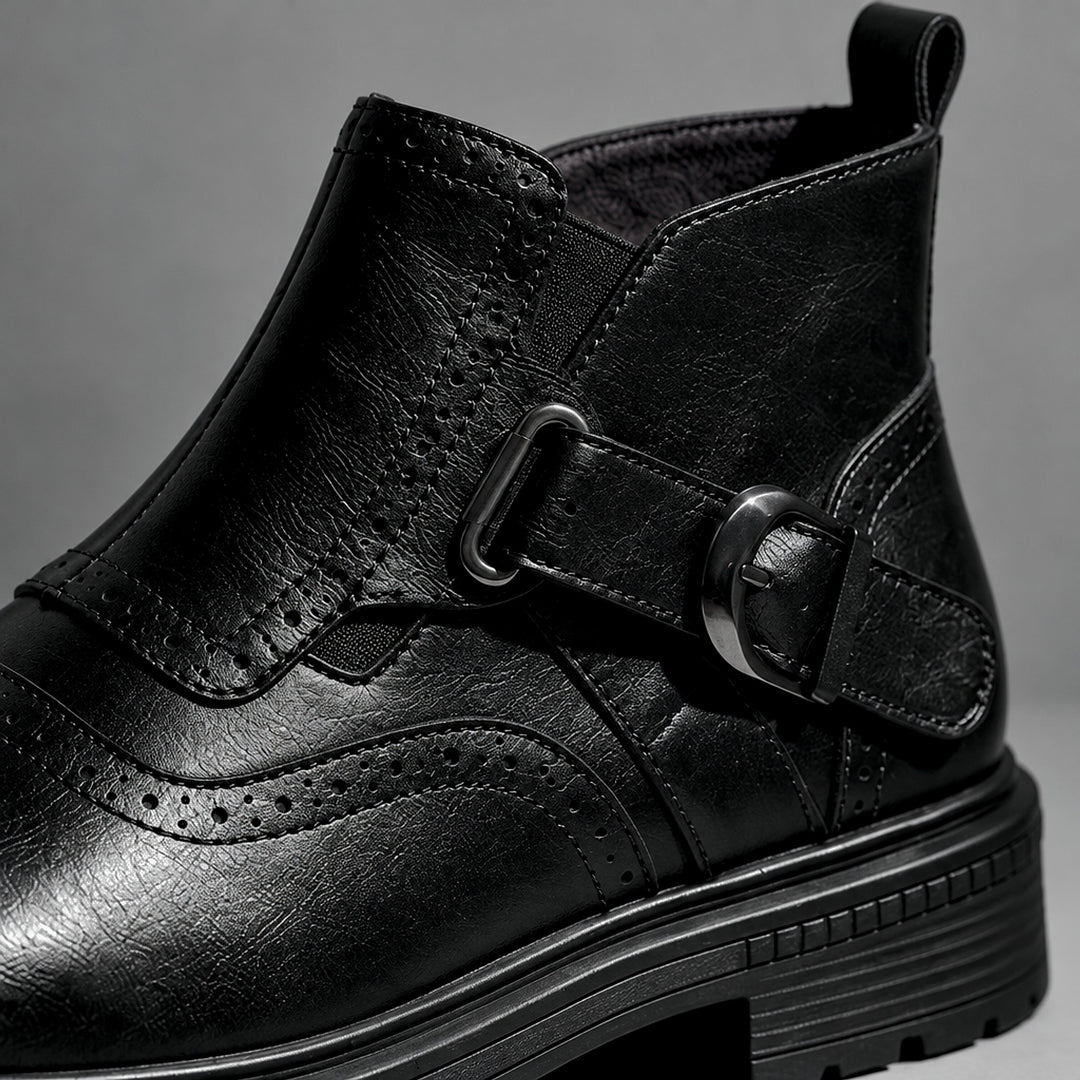 Boot in smooth black leather with black sole and a gunmetal buckle. (detail macro)