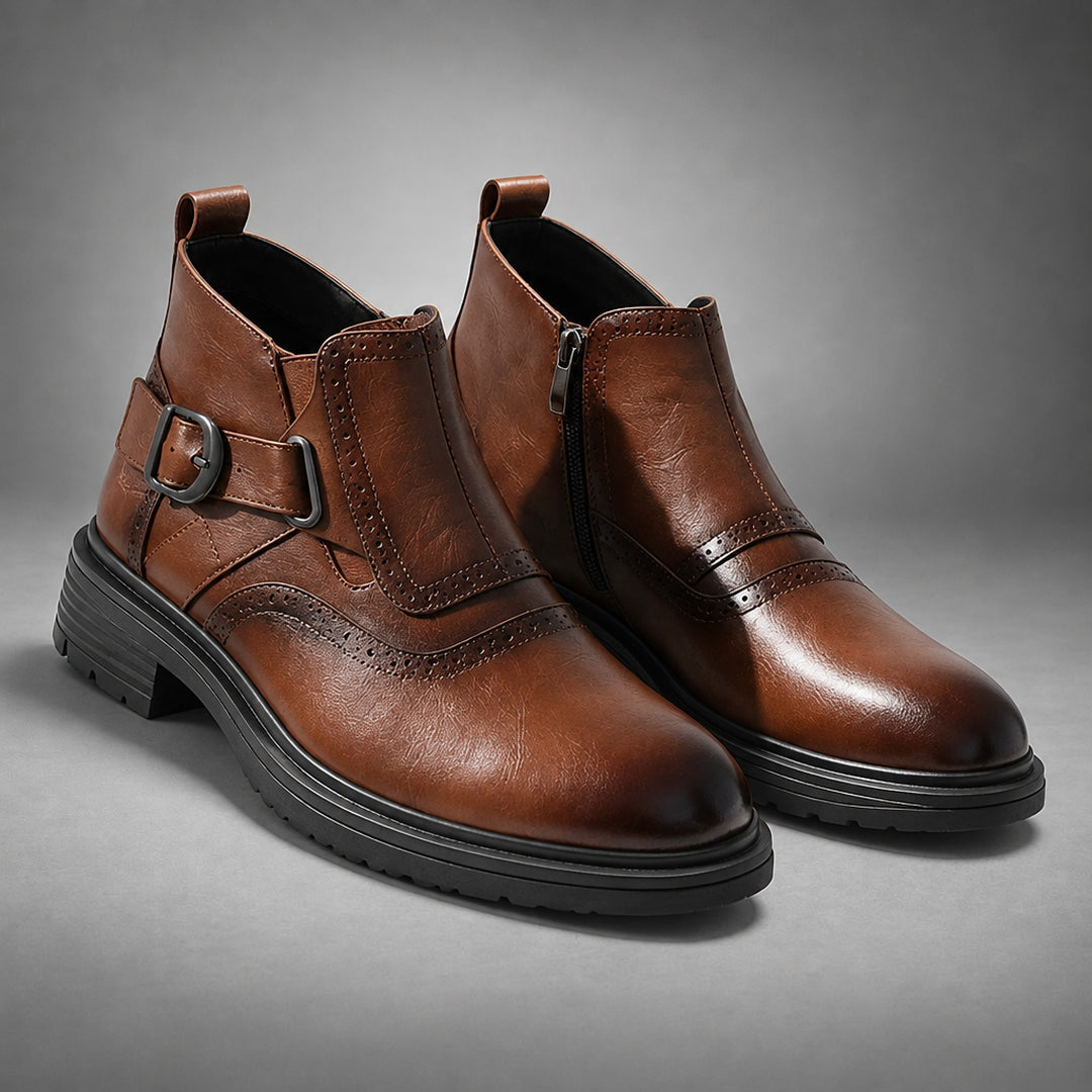 Boot in warm medium brown leather with a black sole and a dark gunmetal buckle.