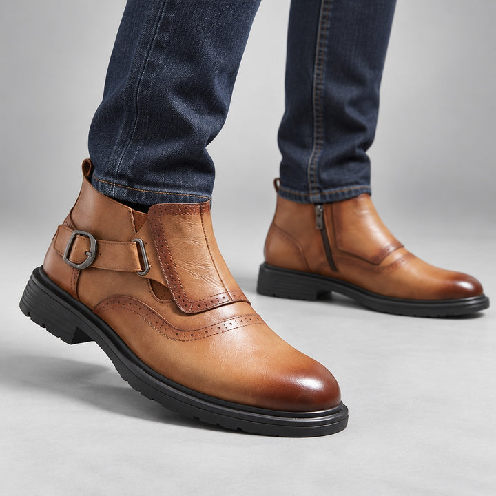 Boot in warm brown leather with a dark brown fade at the toe and strap edges, black sole and gunmetal buckle. (on model)