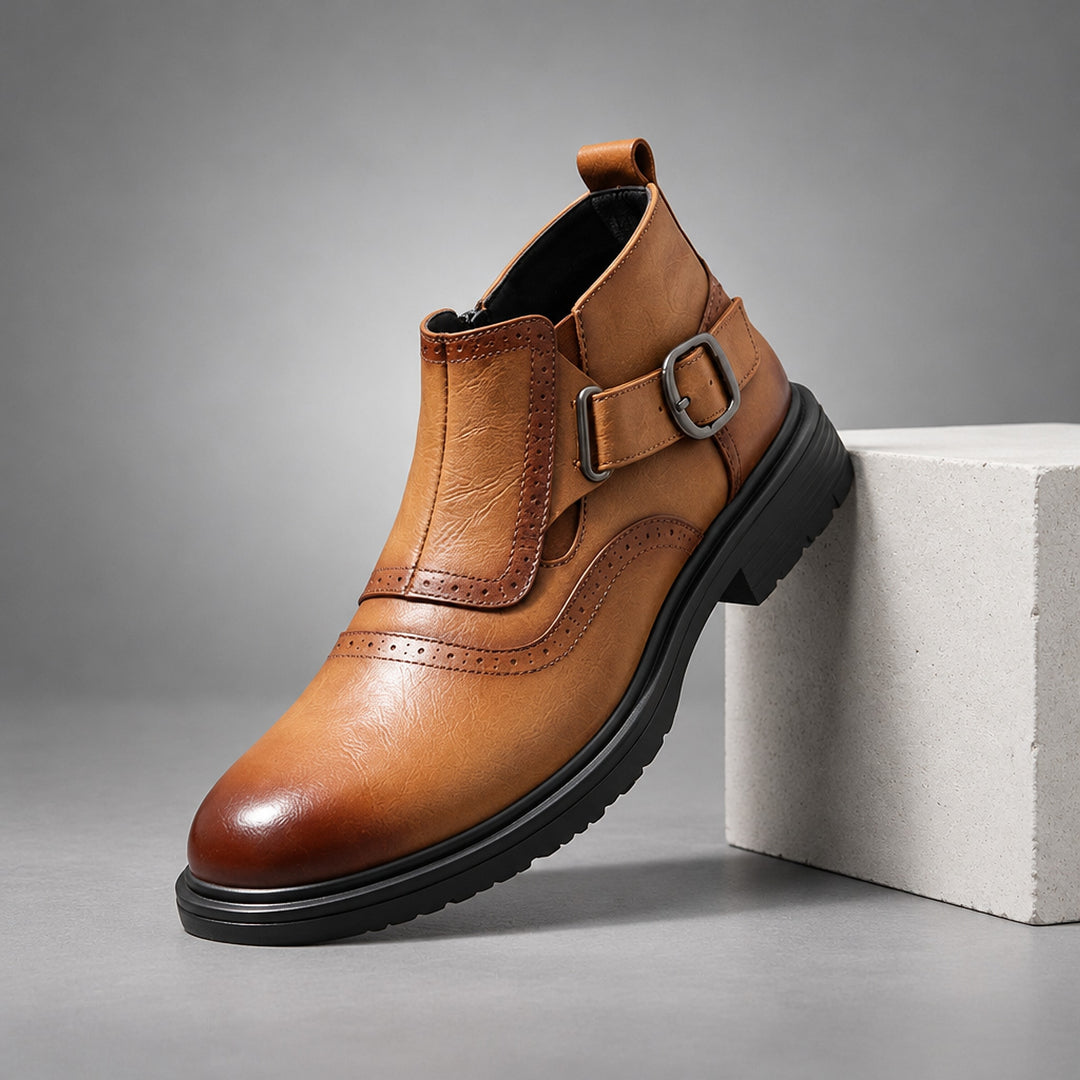 Boot in warm brown leather with a dark brown fade at the toe and strap edges, black sole and gunmetal buckle. (plinth)